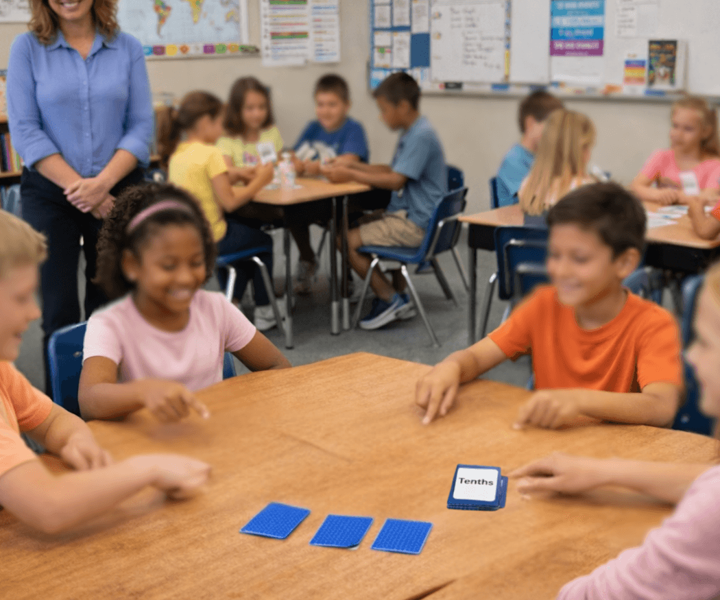 Students playing fraction card games in the classroom